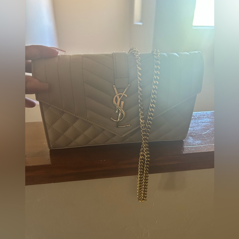 YSL CASSANDRE MATELASSÉ CHAIN WALLET IN GRAIN DE POUDRE EMBOSSED LEATHER